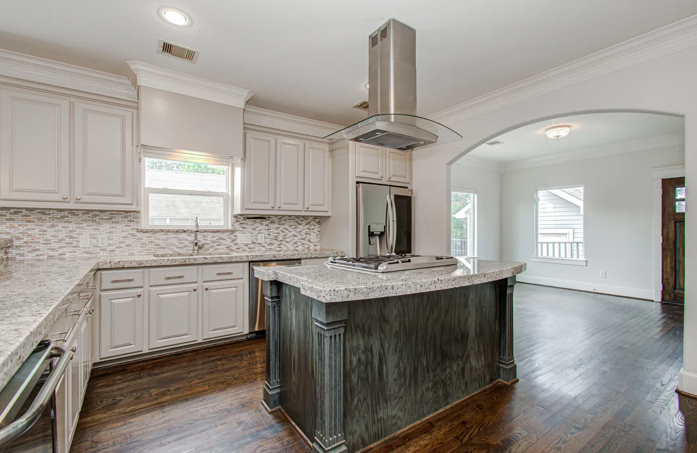 Open kitchen and living area inside a managed single-family rental in Houston Heights